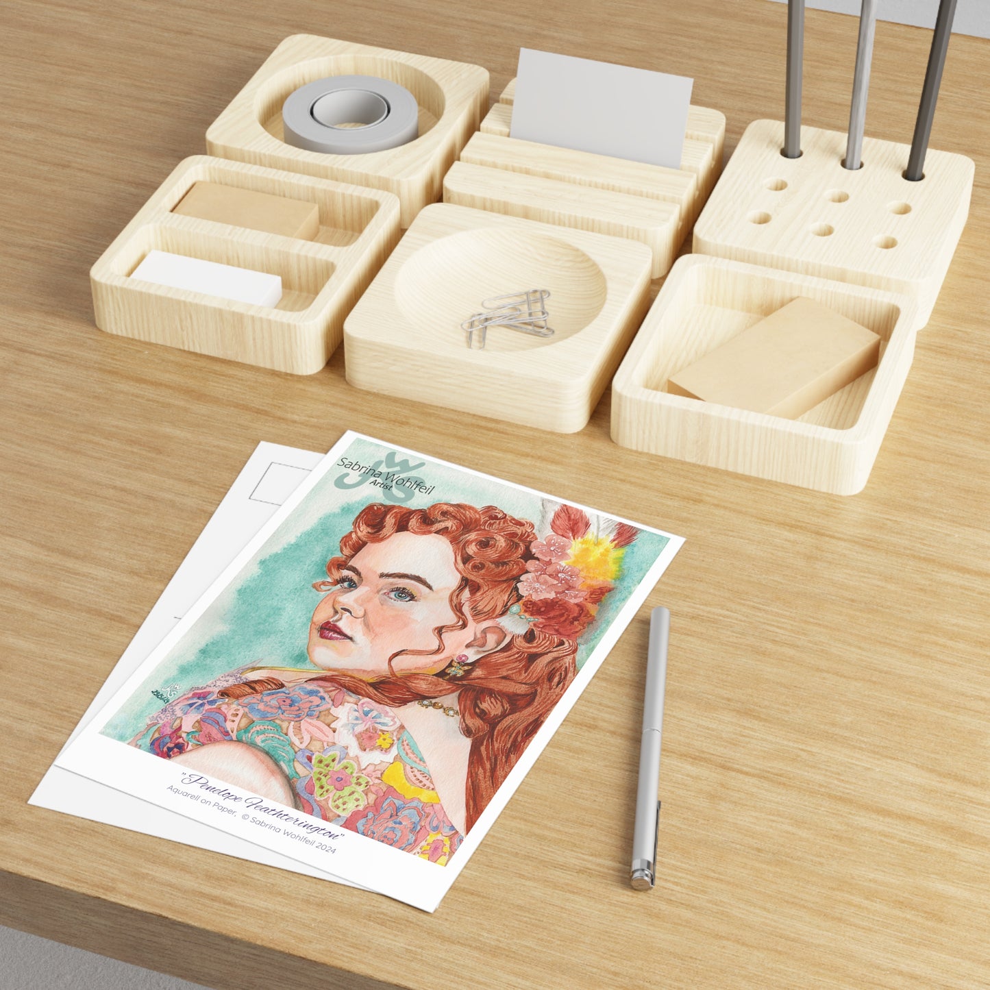 Fine Art Postcard by Sabrina Wohlfeil - Giclée watercolor portrait of Penelope Featherington on glossy paper, desk setup