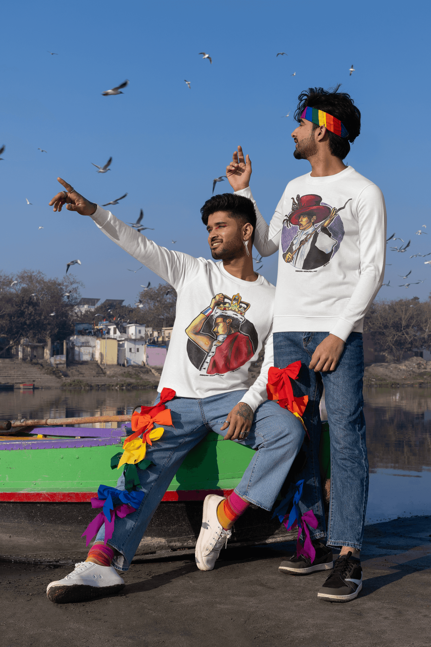 Two men wearing Freddie Mercury Aquarell Print Comic Sketch Unisex Sweatshirts with round neck, designed by Sabrina Wohlfeil, in vibrant outdoor setting.